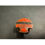 A Shellubricate enamel lapel badge by Fattorini & Sons.