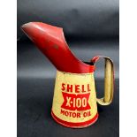 A Shell X-100 Motor Oil pint measure, dated 1956.