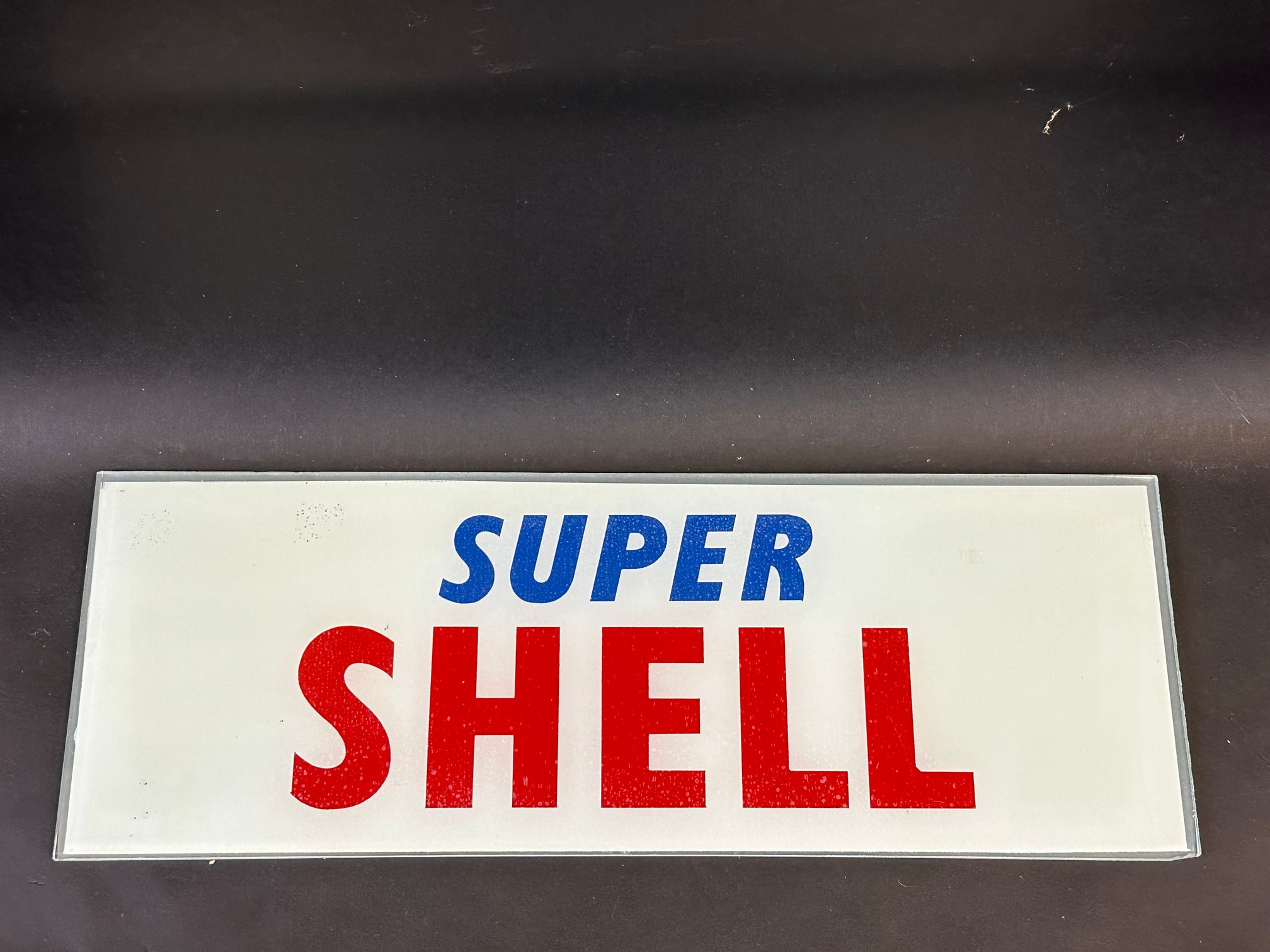 A Super Shell glass petrol pump brand insert, 18 x 6 1/2".