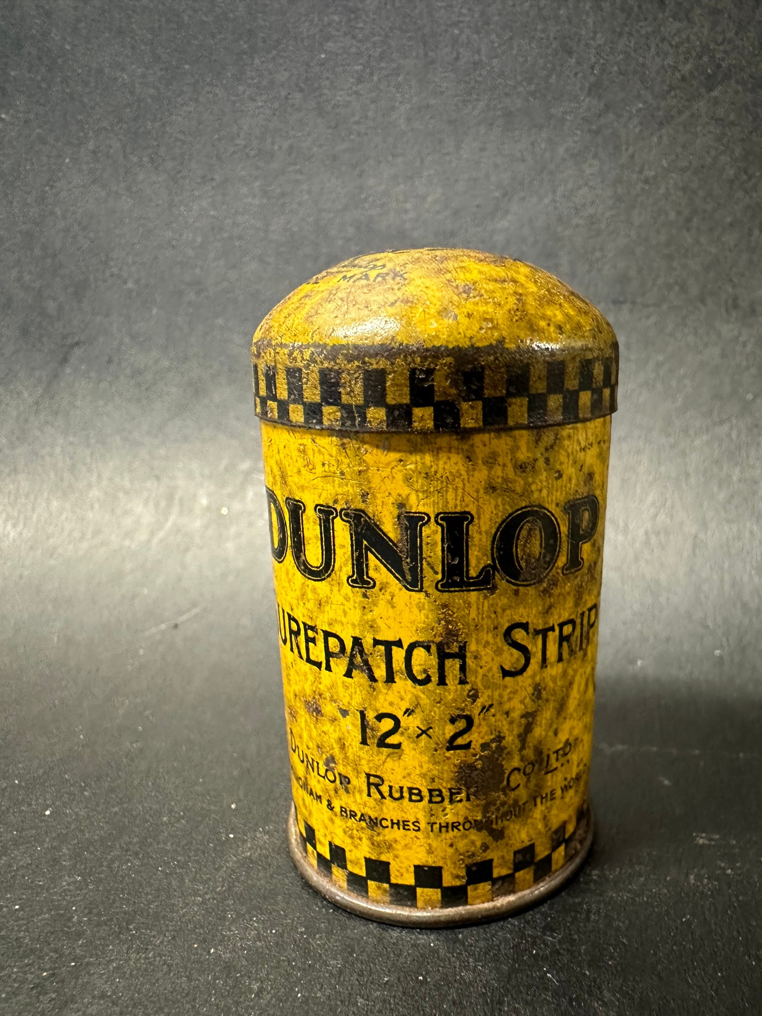 A small Dunlop patch strip tin with image of Mr Dunlop to the lid.