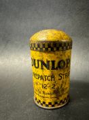 A small Dunlop patch strip tin with image of Mr Dunlop to the lid.