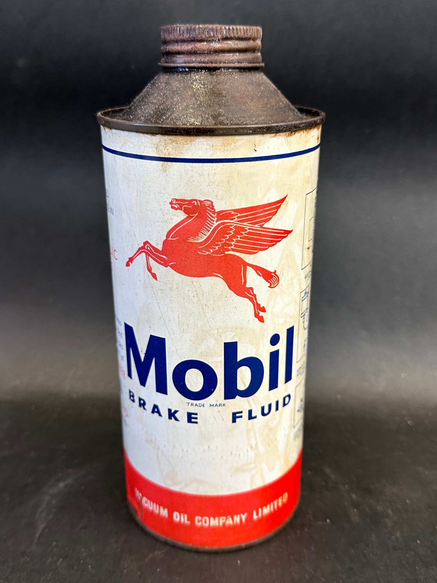 A Mobil Brake Fluid cylindrical quart can.