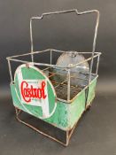 A Wakefield Castrol Motor Oil nine-division crate with two wrap-around enamel signs attached.