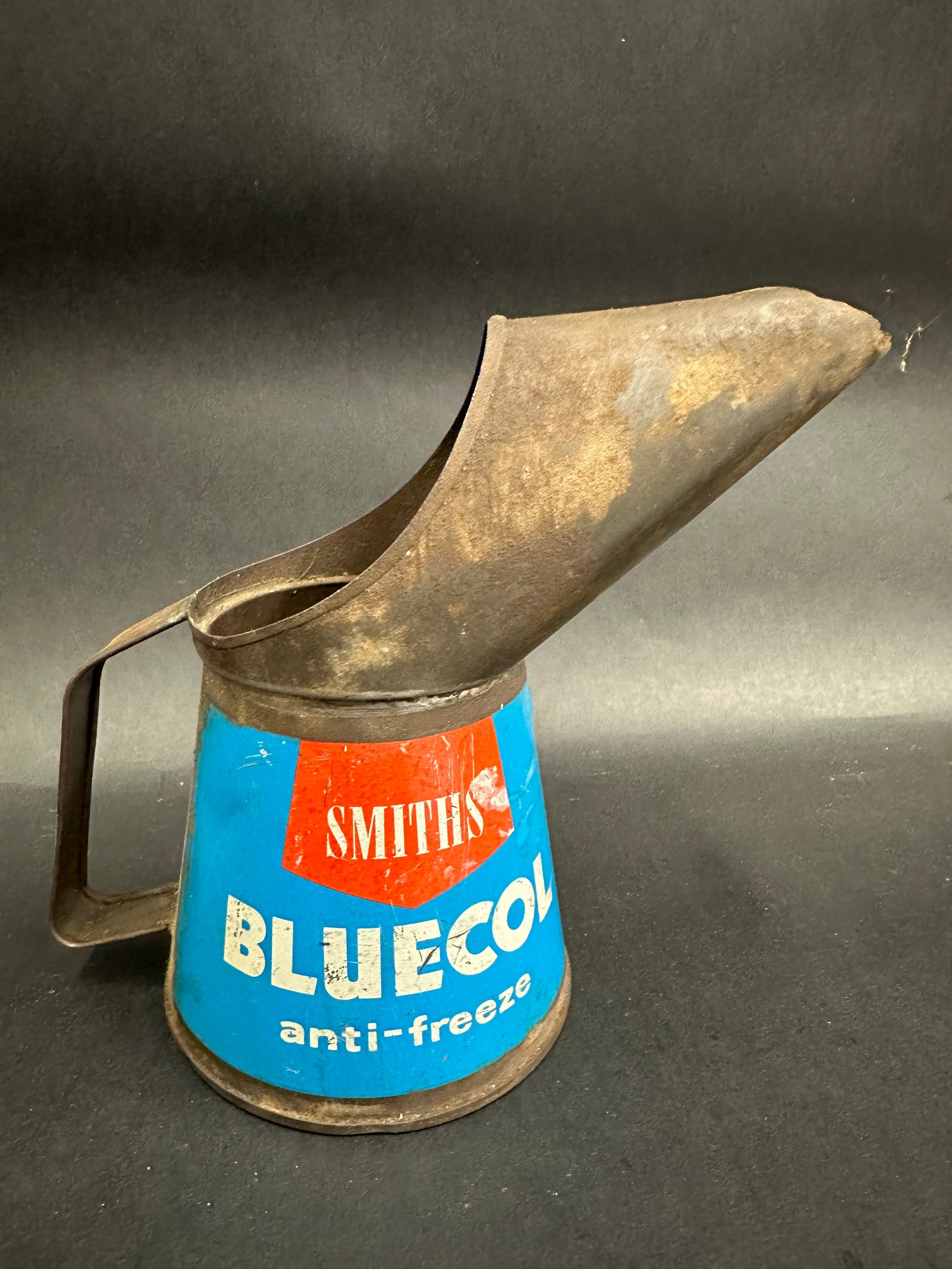 A Smiths Bluecol anti-freeze pint measure, dated 1961.