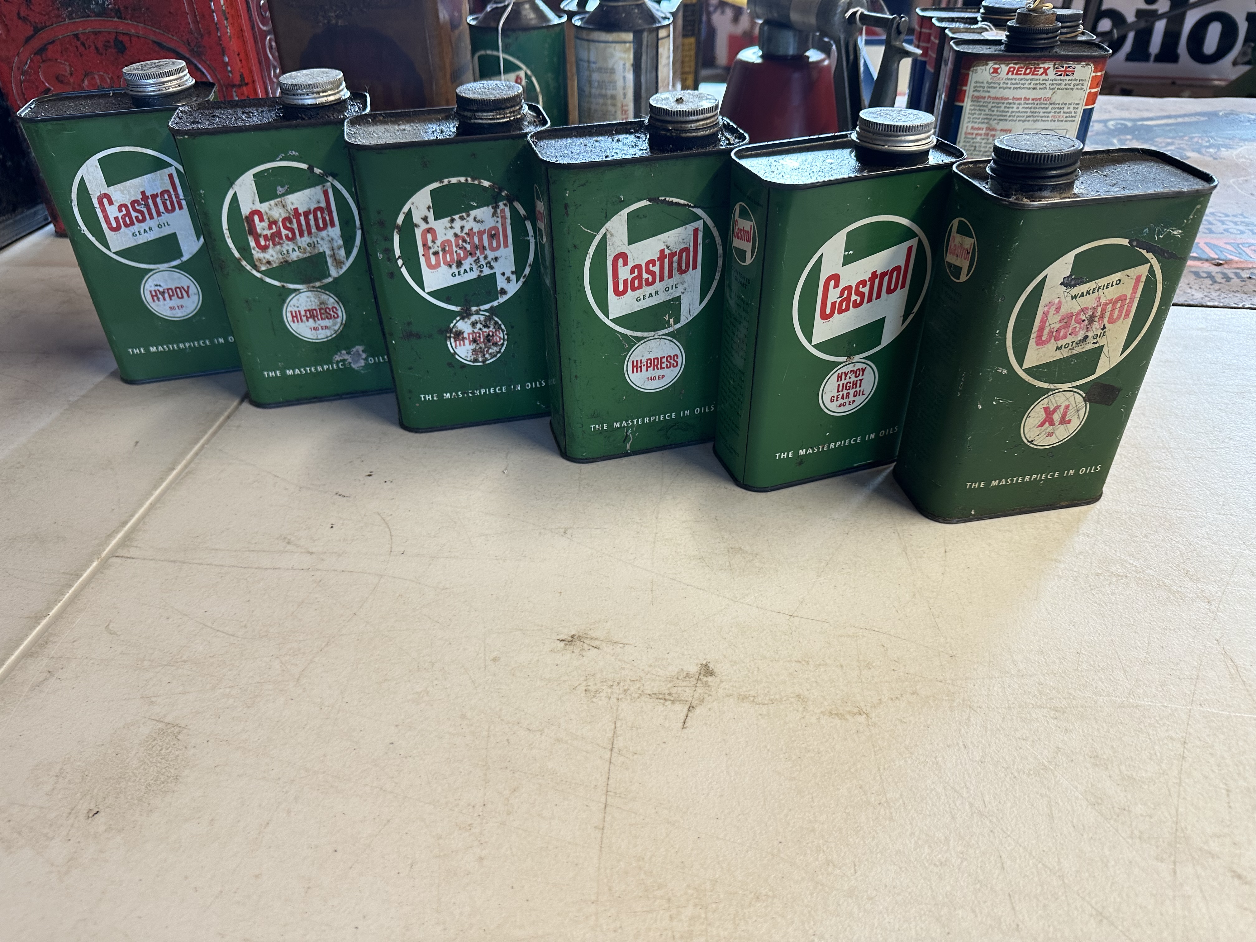 Six Castrol quart oil cans.