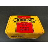 A Dunlop Motor Cycle Tube Repair Outfit tin in superb condition, with assorted contents.