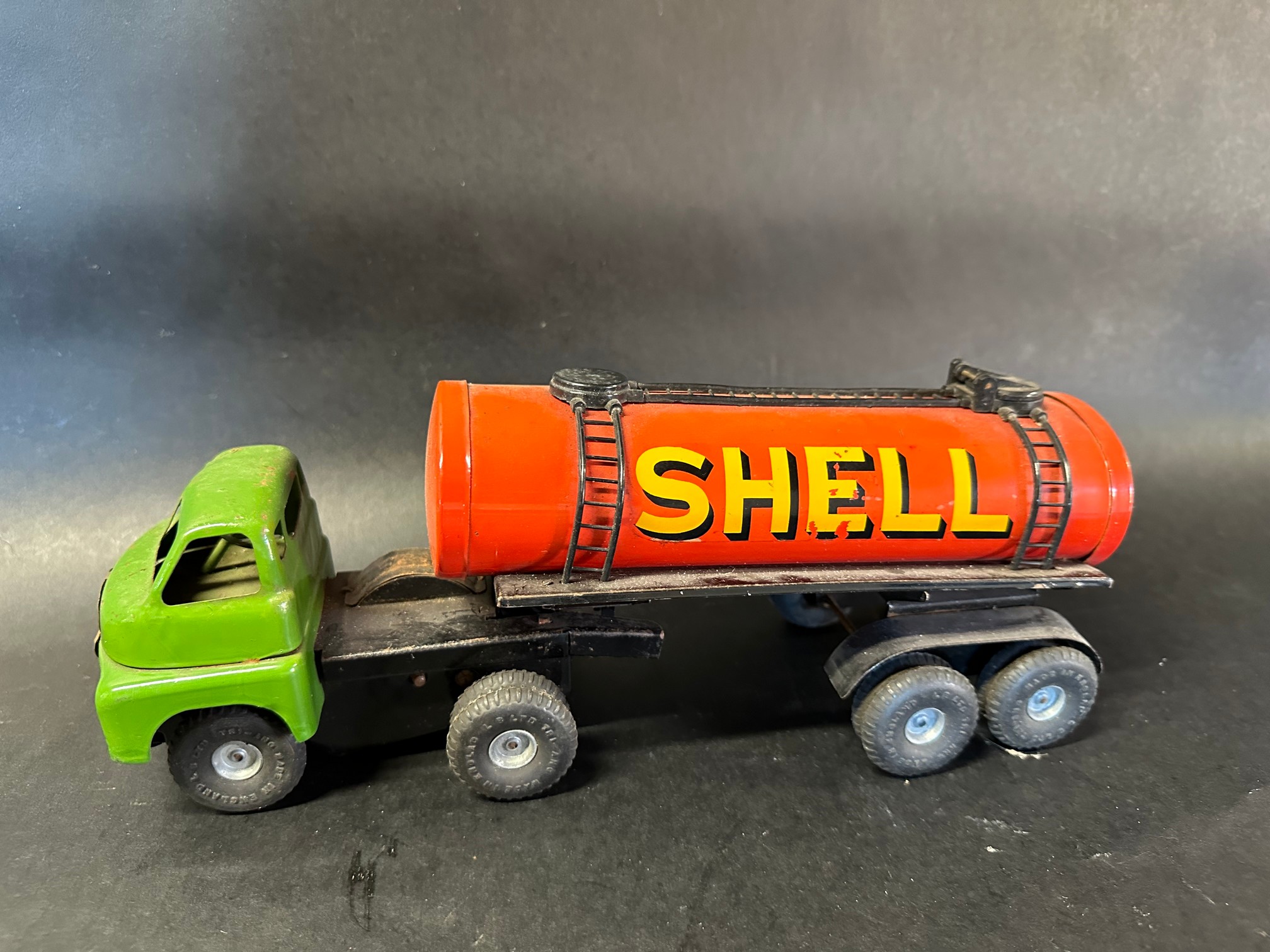 A Tri-ang tinplate model of a Shell and BP petrol tanker.