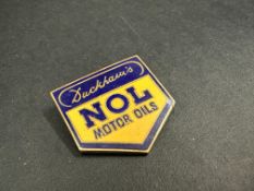 A Duckham's NOL Motor Oils enamel lapel badge by Marples & Beasley.