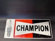 A Champion spark plugs tin advertising sign, 23 x 9 1/2".