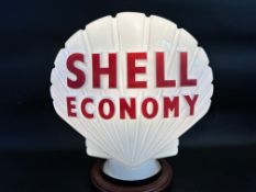 A Shell Economy glass petrol pump globe by Hailware, good condition, dated February 1973.