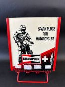 A circa 1980s Champion Spark Plugs counter top dispensing rack, with reversible advert to the