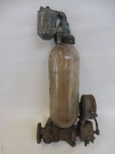 A Hammond glass petrol pump cylinder with measuring dial.