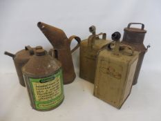 Two Esso Blue Paraffin cans, with different decals plus a half gallon measure, a small churn and a