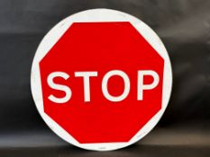 A circular Stop/Go road sign of contemporary manufacture, 24" diameter.