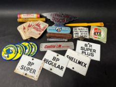 A selection of motoring collectables including four enamel petrol pump brand inserts.