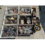 An autojumbler's lot in eight boxes of various parts including sealed beam units, light clusters
