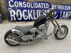 A 49cc child's motorbike in the style of a Harley Davidson.