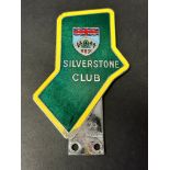 A Silverstone Club car badge, early issue, no.74, with yellow border.