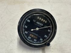 A Jaeger 0-80mph black-faced speedometer.