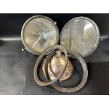 A pair of Lucas P100 headlamps for restoration.