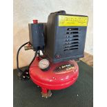 A boxed Am-Tech Mini Pancake Air Compressor.