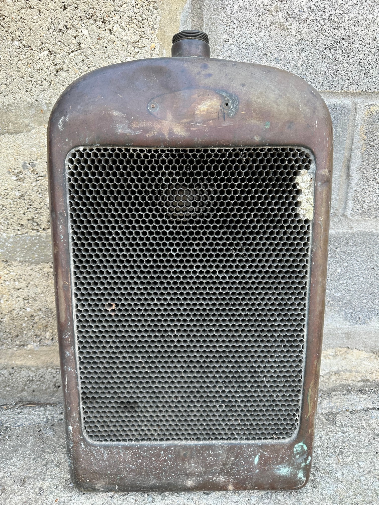 A Lagonda 11.9hp radiator cowl and core, lacks badge.