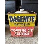 A garage forecourt rack with tin sign to the front advertising Dagenite Batteries 'Topping Up