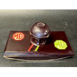 An MG bakelite blotter.