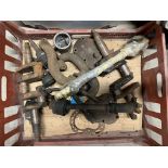 A crate of assorted mechanical parts.