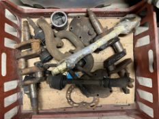 A crate of assorted mechanical parts.