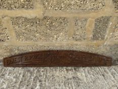 A cast iron name plate for Ernest R. Price Ltd Cardiff, 37 1/2 x 6".