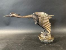 A rare French silver plated car accessory mascot in the form of a heron or stork, signed Paitken,