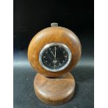 A Smiths eight day car clock in wooden desk mount, with hand carved MG related inscription to the