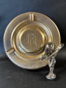 A Rolls-Royce car mascot plus a Rolls-Royce hub cap forming an ashtray.