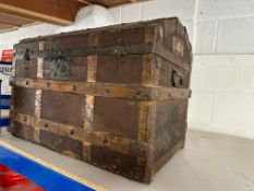 A wooden bound dome topped trunk.