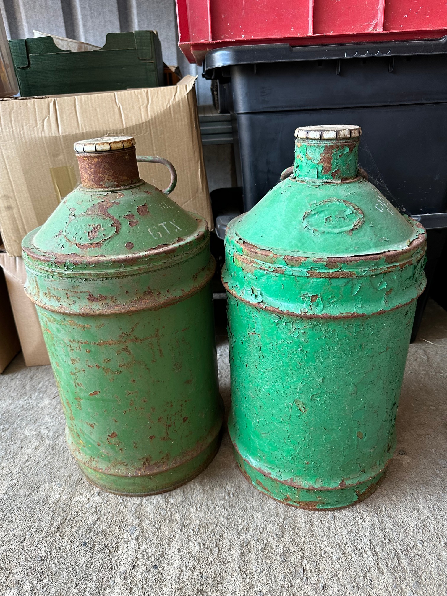 Two Castrol five gallon drums with correct caps.