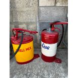 Two garage forecourt greasers, repainted in bright colours.