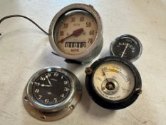 A Smiths 0-70mph speedometer, a Stadium 8-day rim wind car clock, an accumulator indicator and an