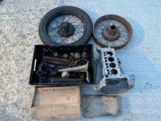 A quantity of Austin 7 parts including crankcase, 18" wire wheel, engine parts etc.