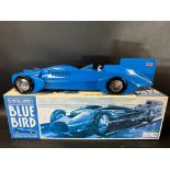 A boxed contemporary tinplate model of Sir Malcolm Campbell's Bluebird, made by Schylling.
