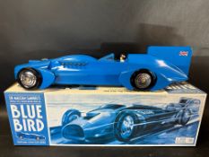 A boxed contemporary tinplate model of Sir Malcolm Campbell's Bluebird, made by Schylling.