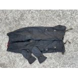 A pair of Belstaff wax cotton leggings and a pair of Belstaff wax cotton mittens.