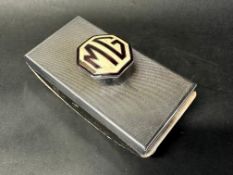 An MG chrome plated blotter.