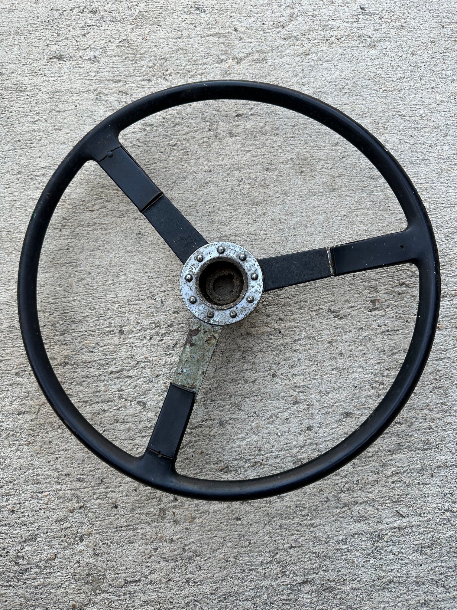 A circa 1950 three spoke steering wheel.