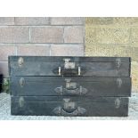 A set of three stacking trunks, these would have fitted in a larger car trunk, shaped to the rear