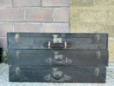 A set of three stacking trunks, these would have fitted in a larger car trunk, shaped to the rear