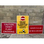 Three modern construction site warning signs.