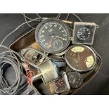 A Smiths 0-5500 black-faced rev. counter with integral clock, plus various other instruments