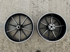 A pair of Harley Davidson wheels, appear either brand new or recently restored.