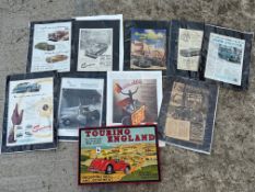 A reproduction Touring England board game and a selection of magazine adverts of classic cars.
